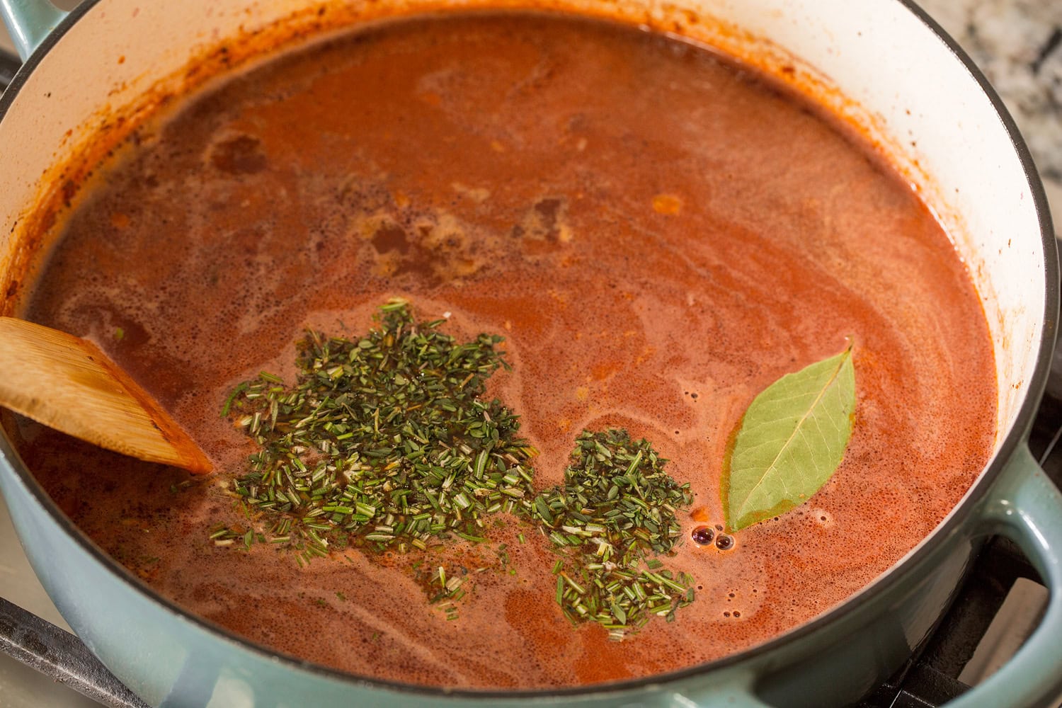 Broth and herbs added to stew.