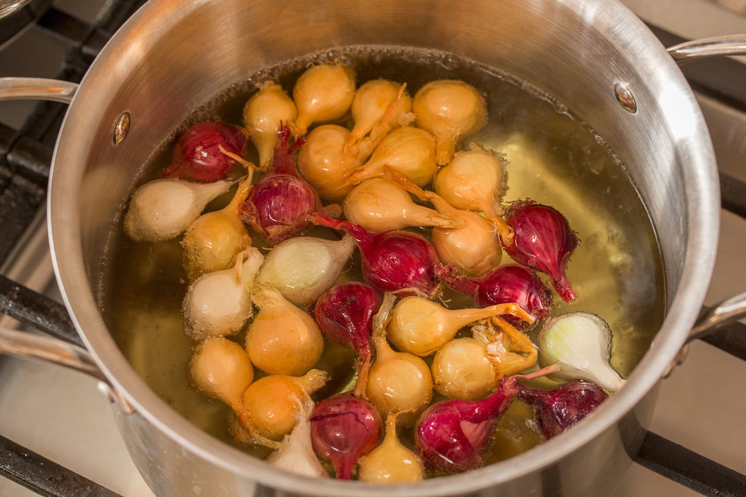 Pearl onions boiling, done for easier peeling. 