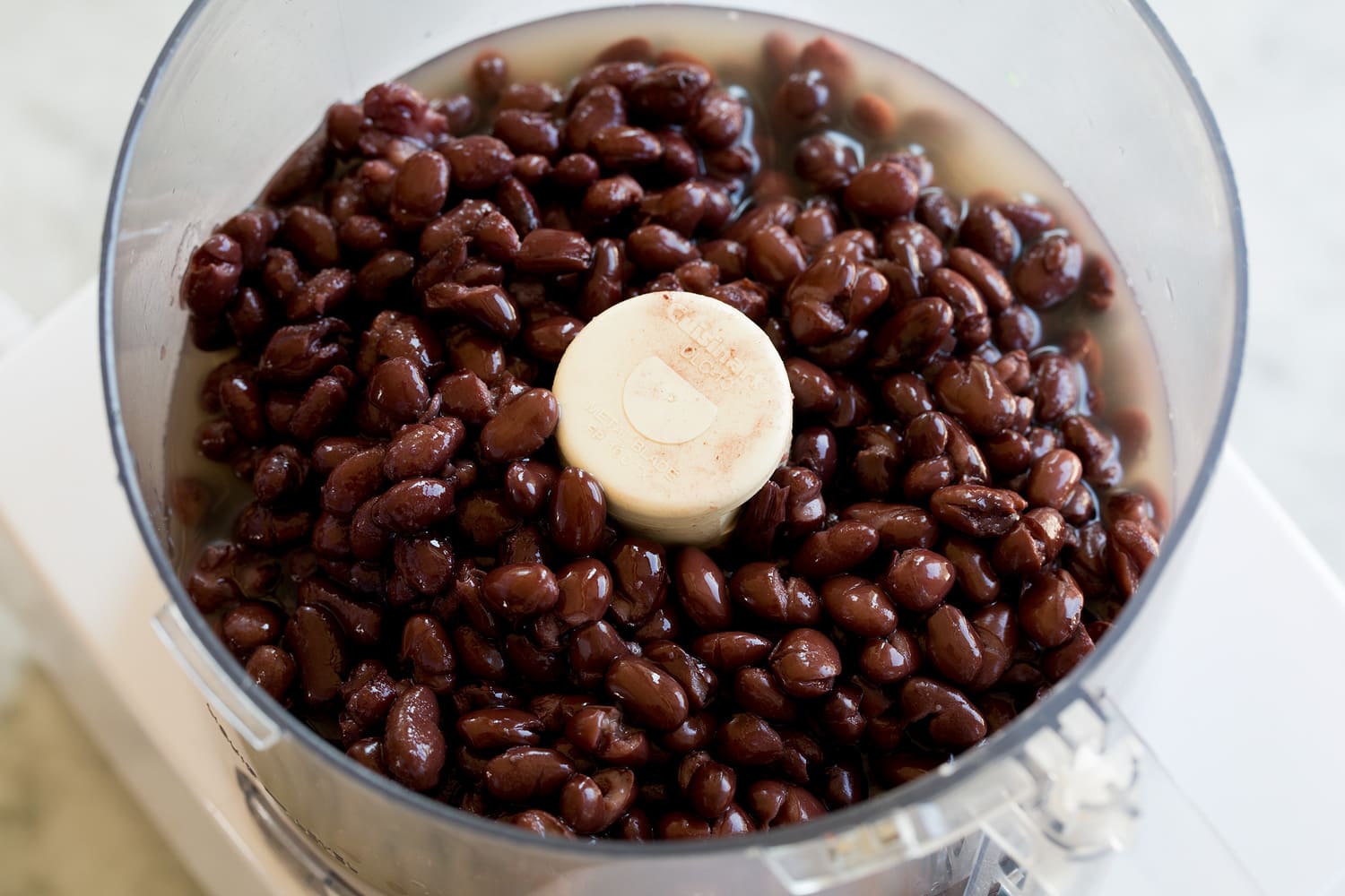 Black beans in a food processor.