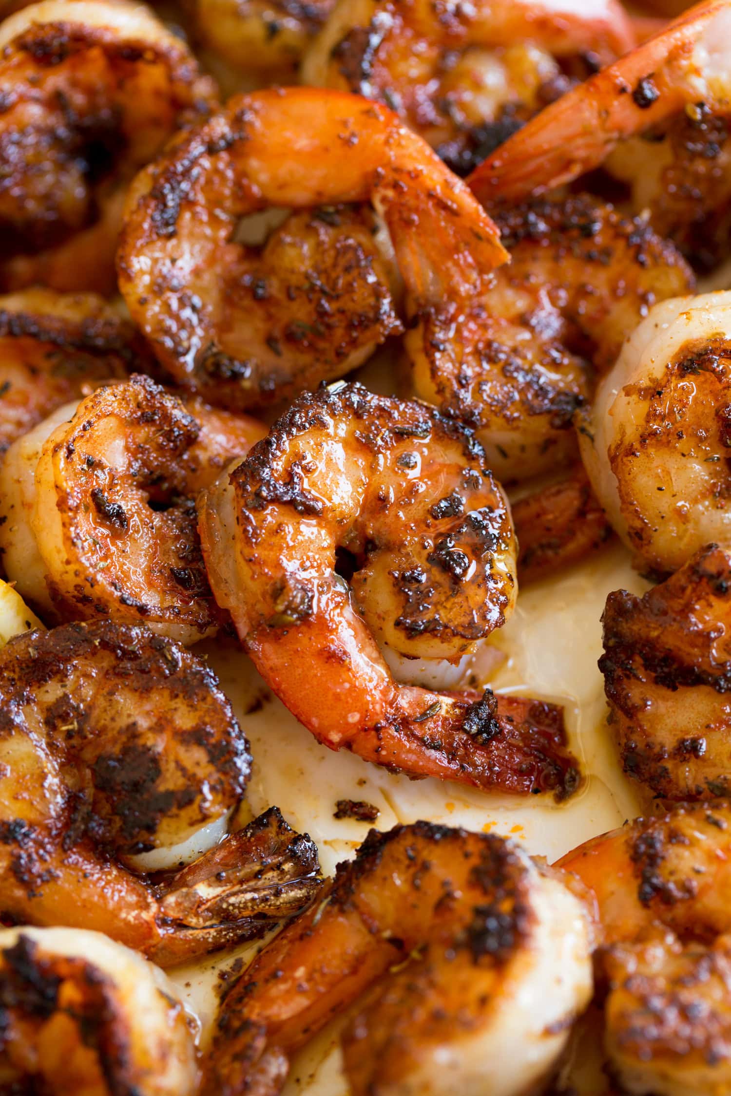 Close up photo of seasoned blackened shrimp.