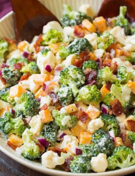 A close up of a broccoli and cauliflower salad in a bowl