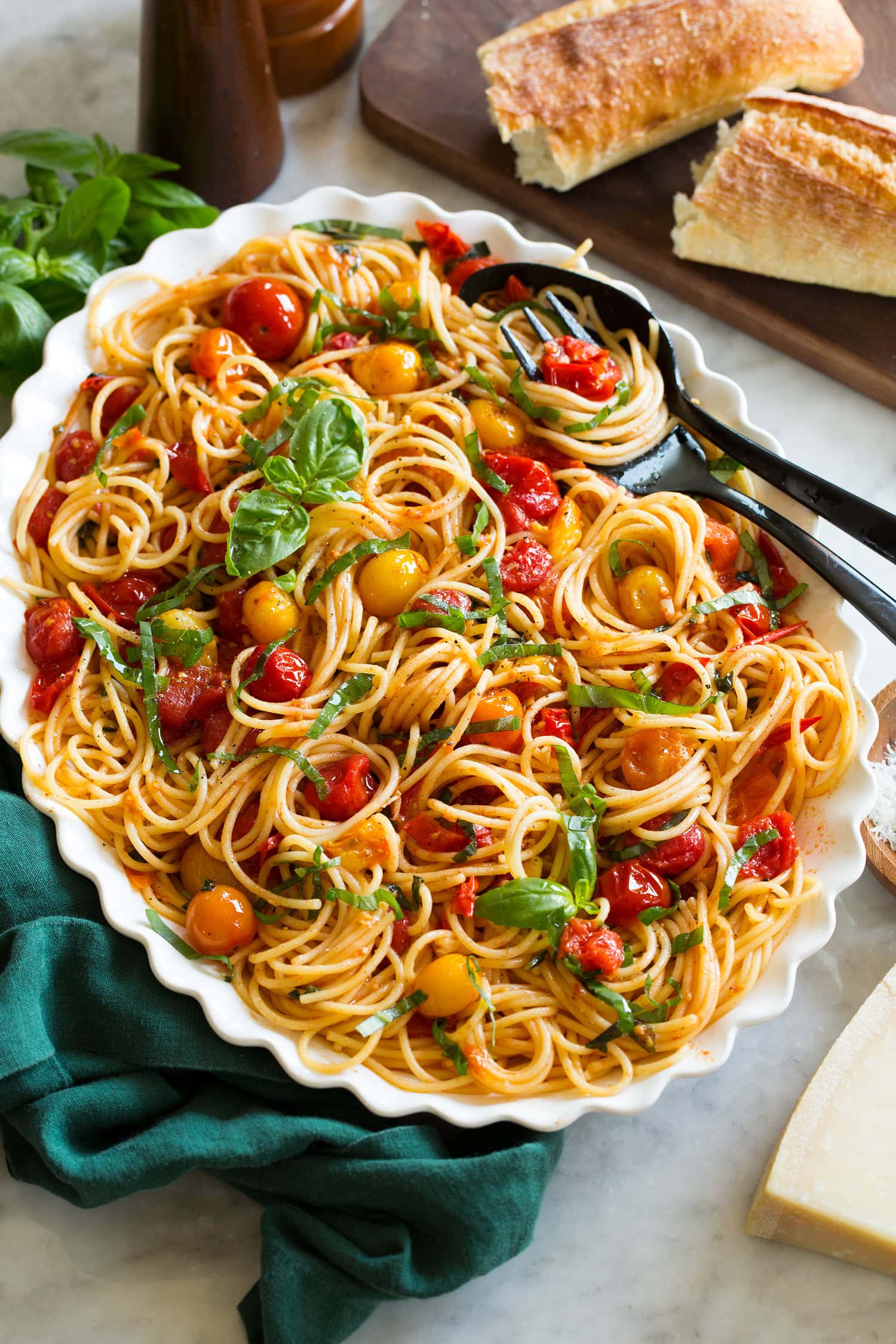 Cherry tomato pasta shown at a side angle on a large serving platter.