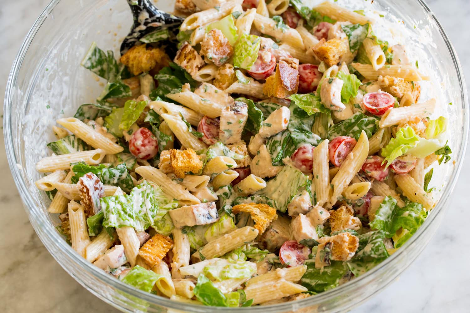 Completed pasta salad in mixing bowl.