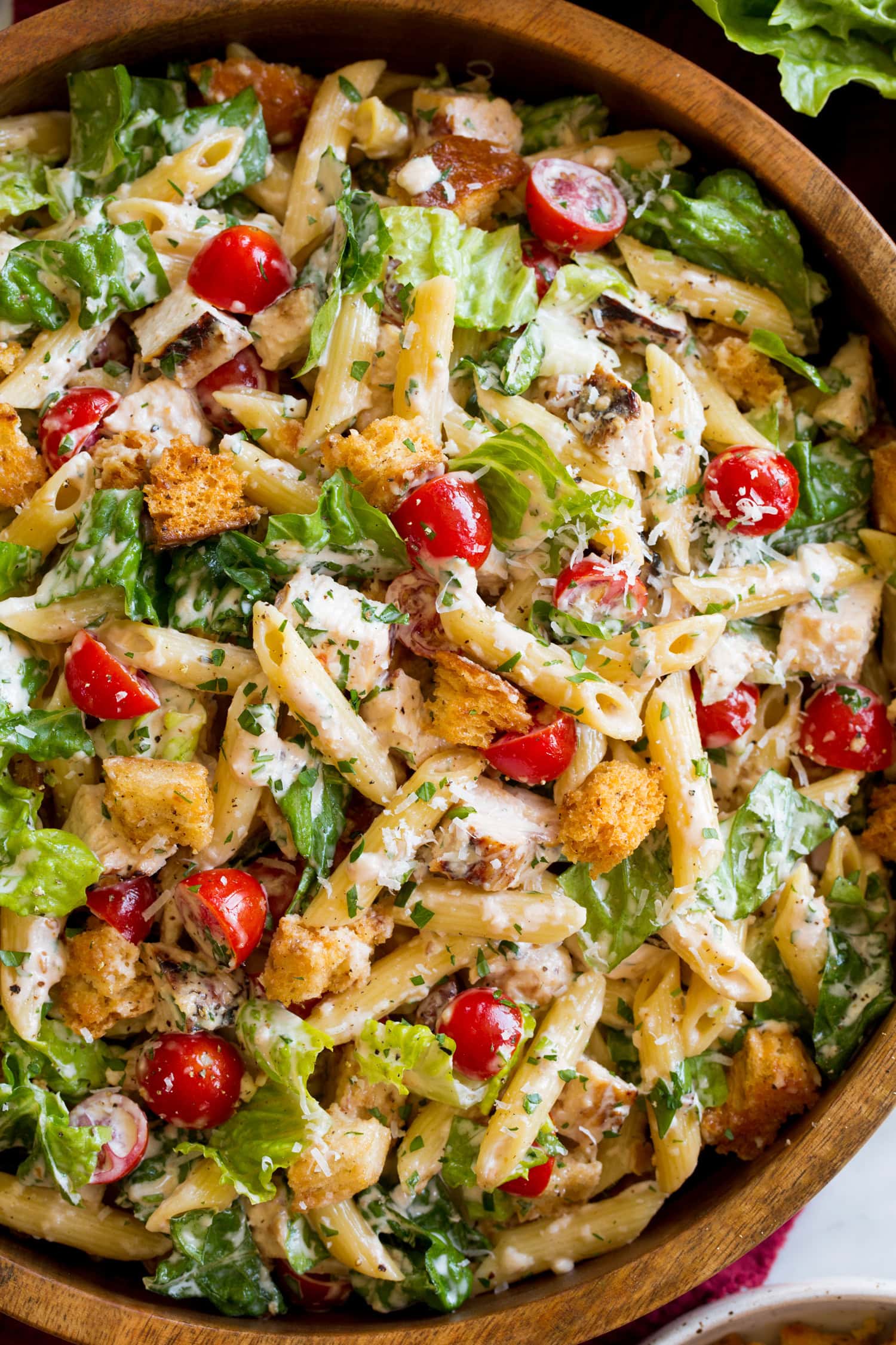 Caesar pasta salad shown close to show various ingredients and textures.