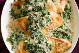 Pan seared chicken breasts with spinach sauce.