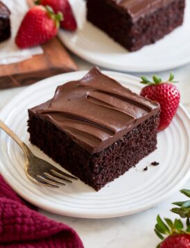 Slice of easy to make chocolate cake covered with a chocolate ganache frosting.