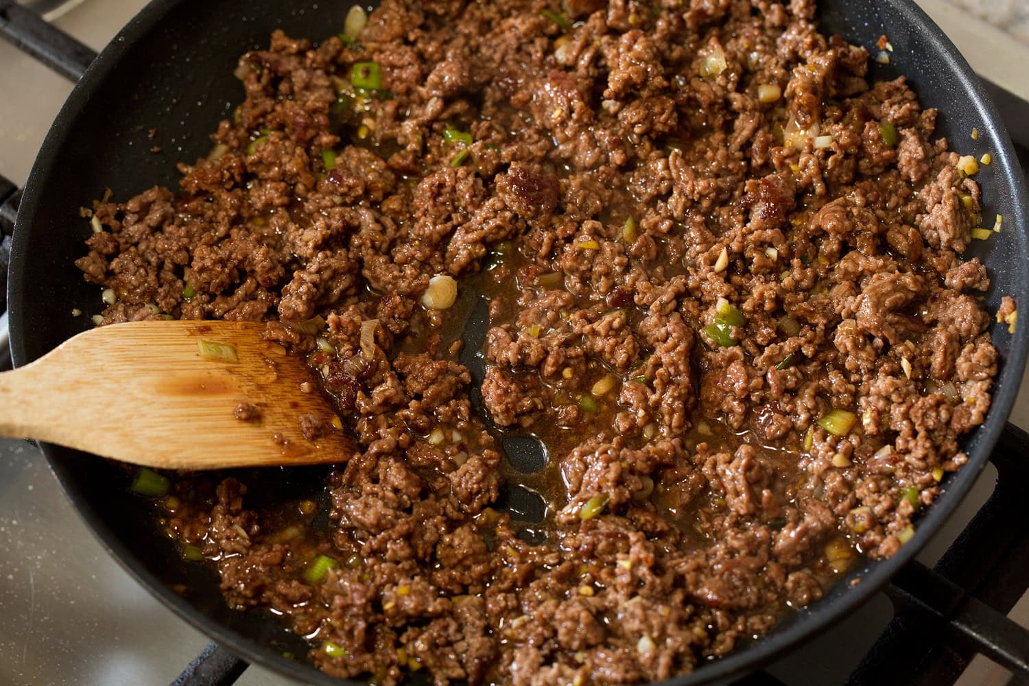 Completed Korean ground beef shown in the skillet with thickened sauce.