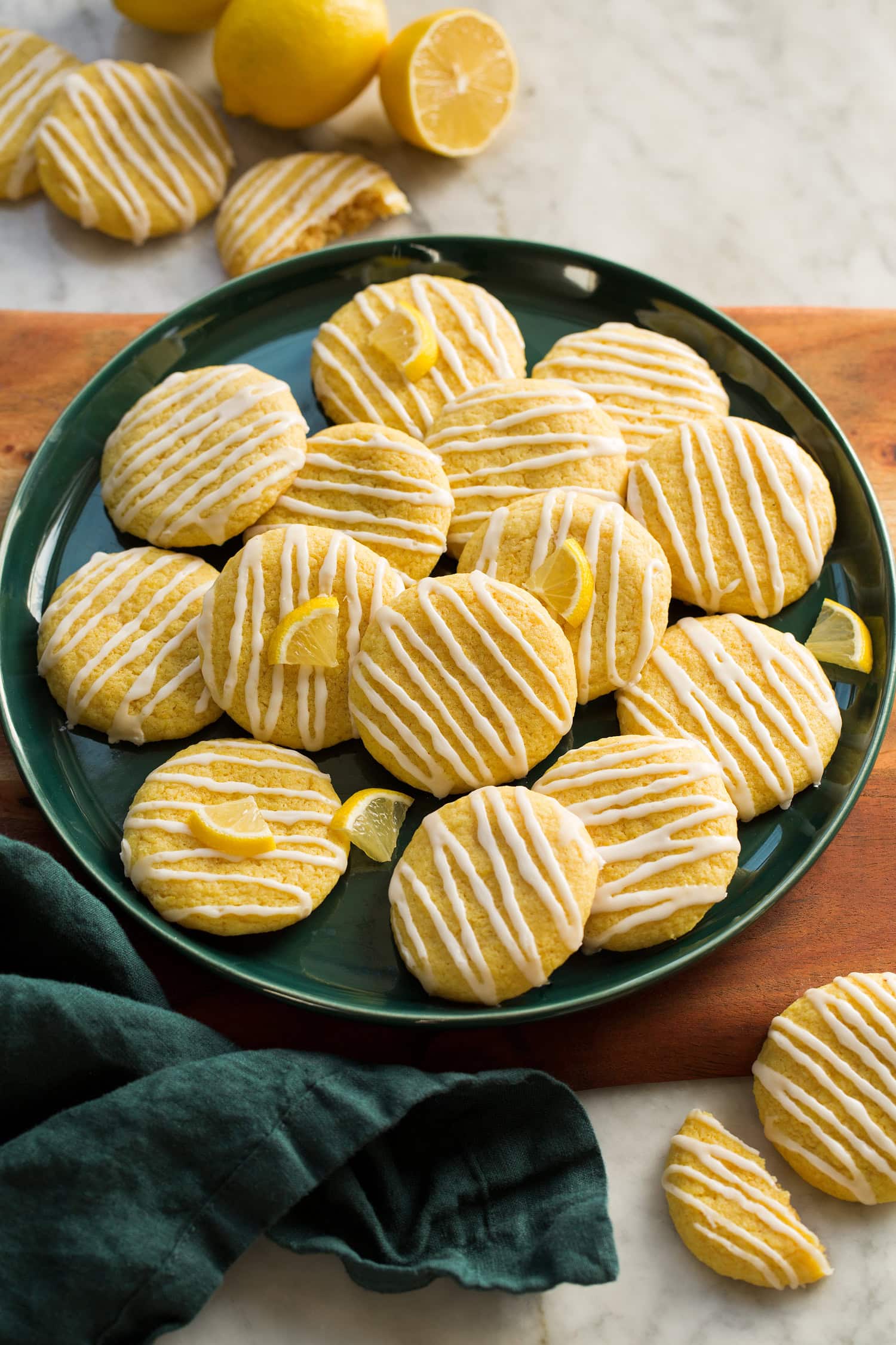 Plate of lemon cookies with icing.