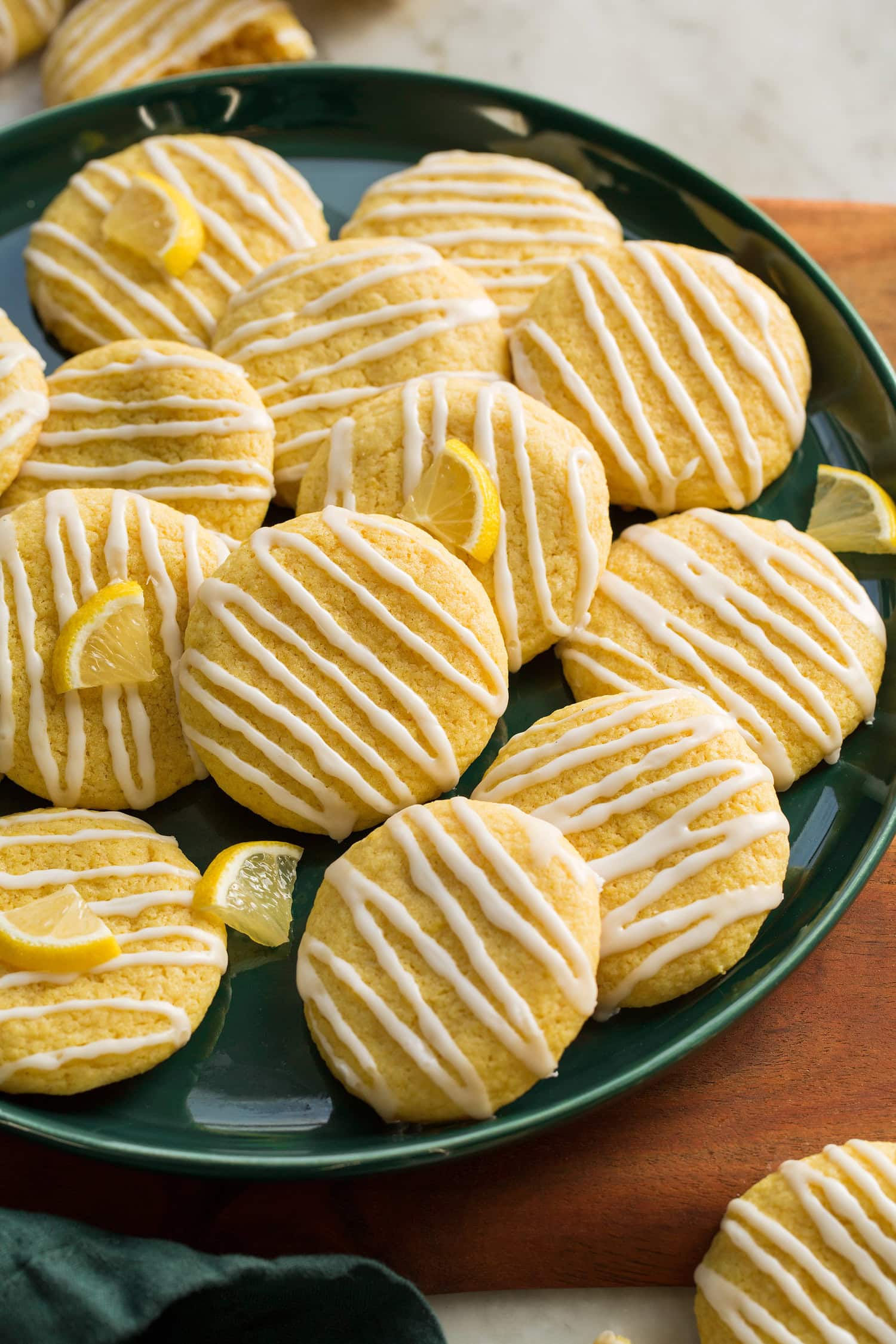 Close up photo of soft lemon cookies with zigzags of glaze atop.