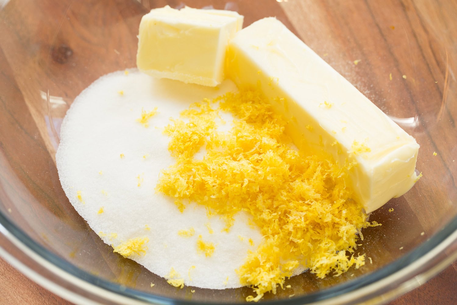 Butter, lemon zest and sugar in a mixing bowl.