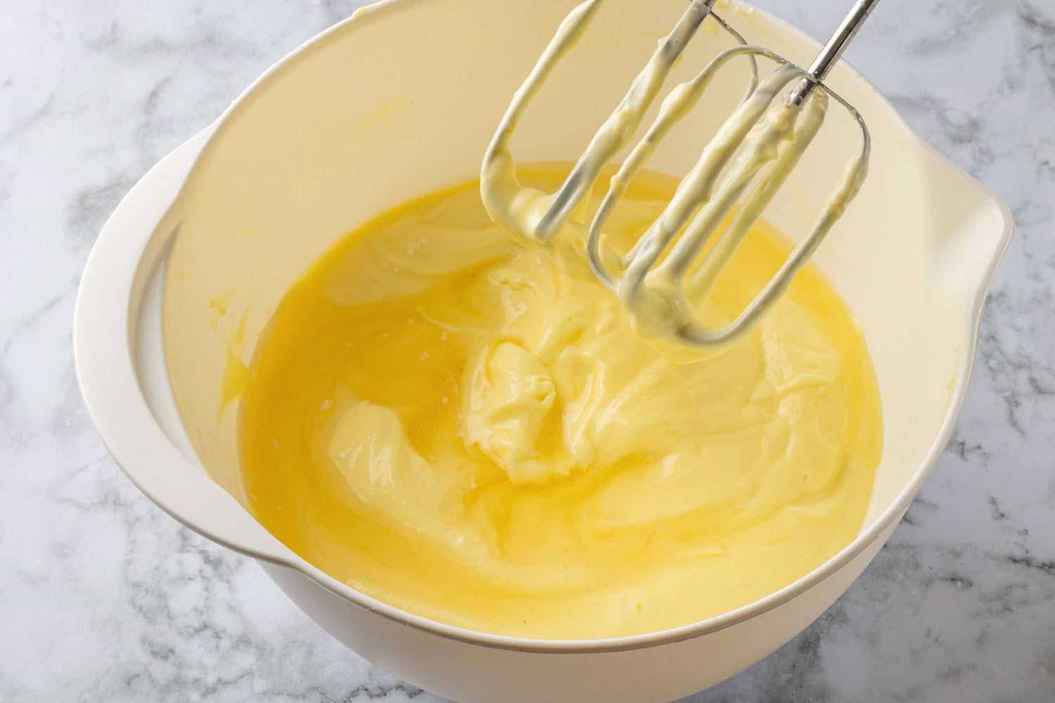 Gelatin added to lemon pie mixture in mixing bowl.