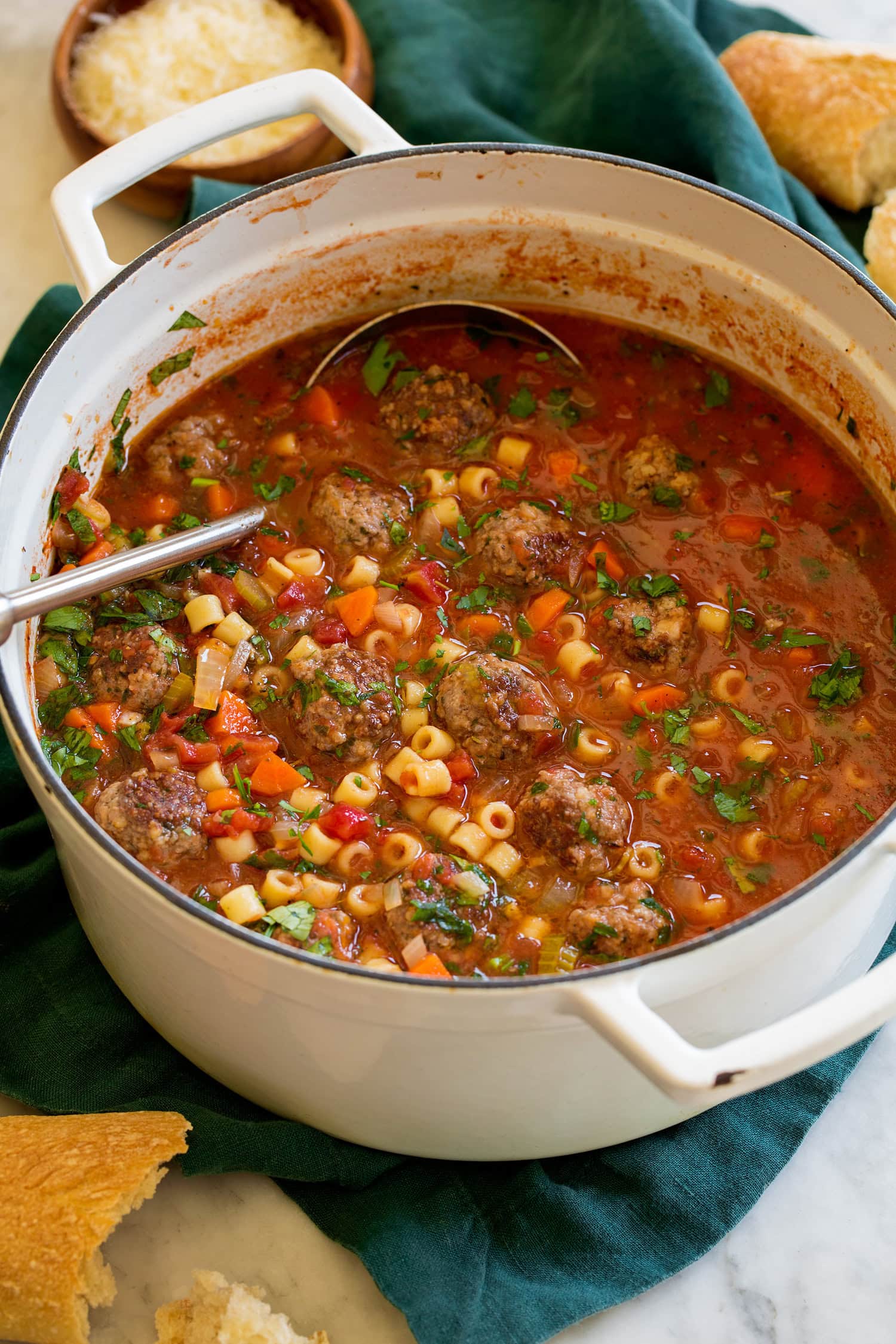 Pot of meatball soup with ladle.