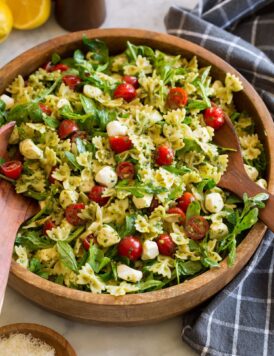 Pesto pasta salad with homemade pesto, baby arugula, grape tomatoes and fresh mozzarella pearls.