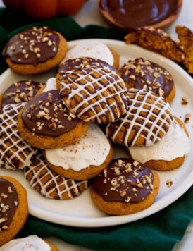 Pumpkin cookies with chocolate and vanilla icing.