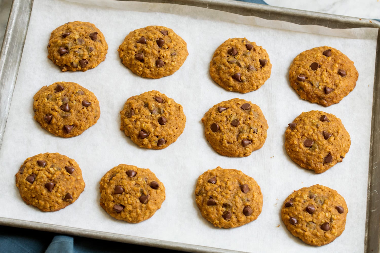 Baked pumpkin oat cookies on cookie sheet.