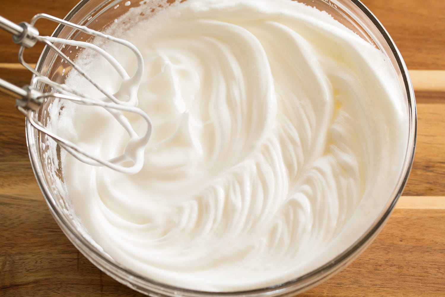 Whipped egg whites in a mixing bowl for waffles.