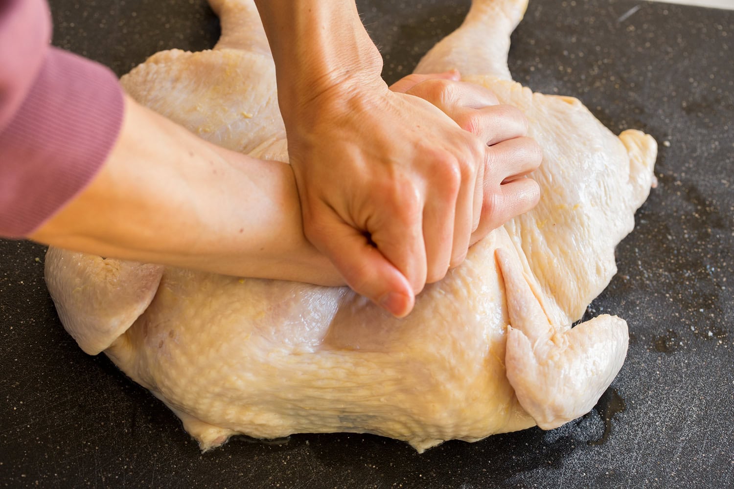 Breaking bone for spatchcock chicken.