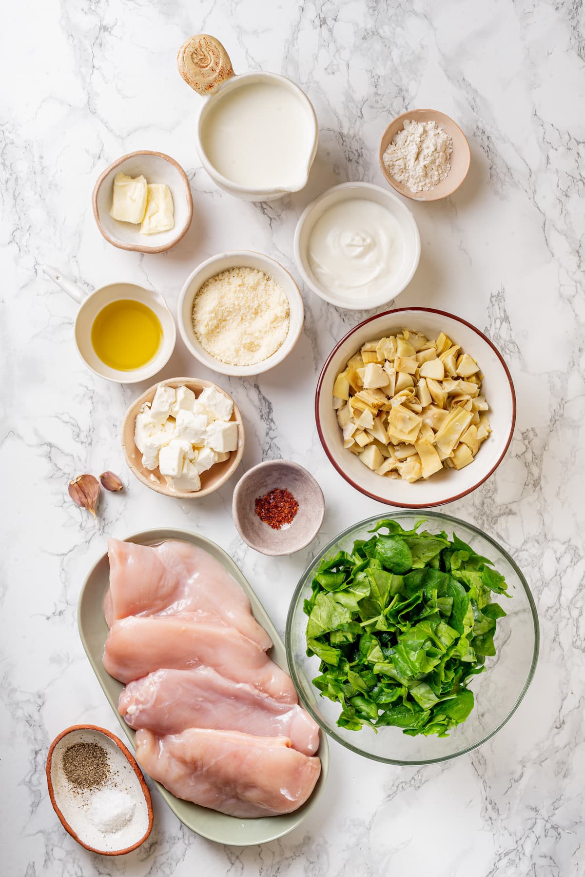 Ingredients for spinach artichoke chicken.