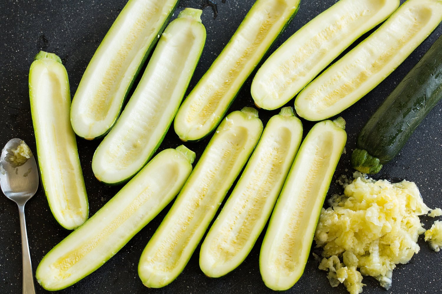 Zucchini boats with scooped out flesh.